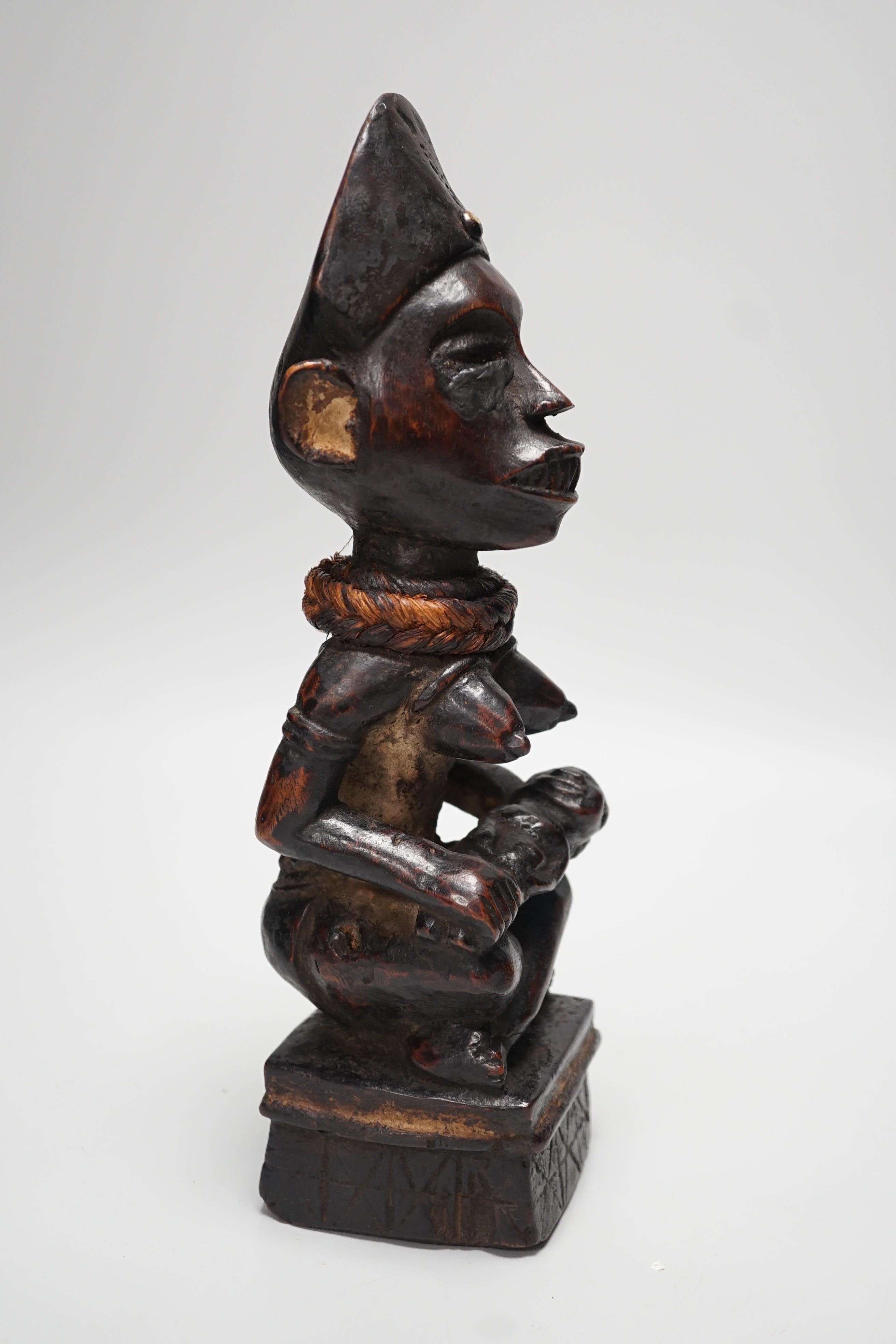 An African tribal wooden maternity figure, Yombe tribe Congo 30cm